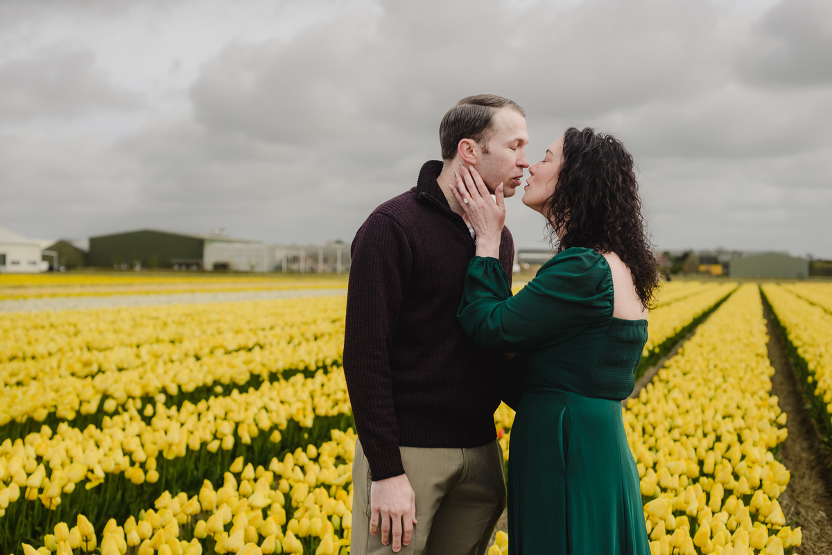 Romantic portrait of a couple among Dutch tulips.