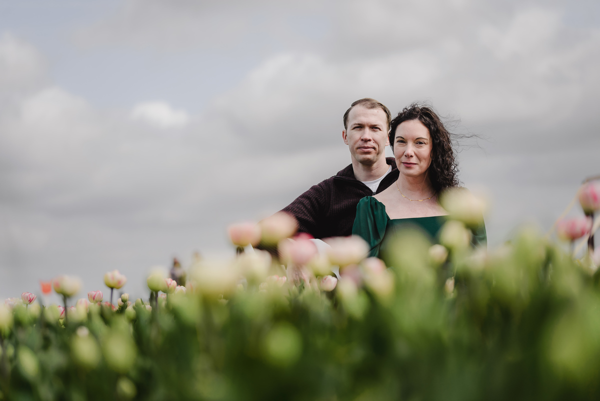 Close portrait of an engaged couple in the tulip fields.