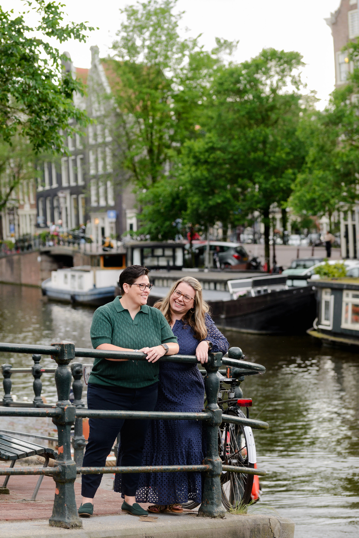 Couple embracing beside one of Amsterdam's historic canals.