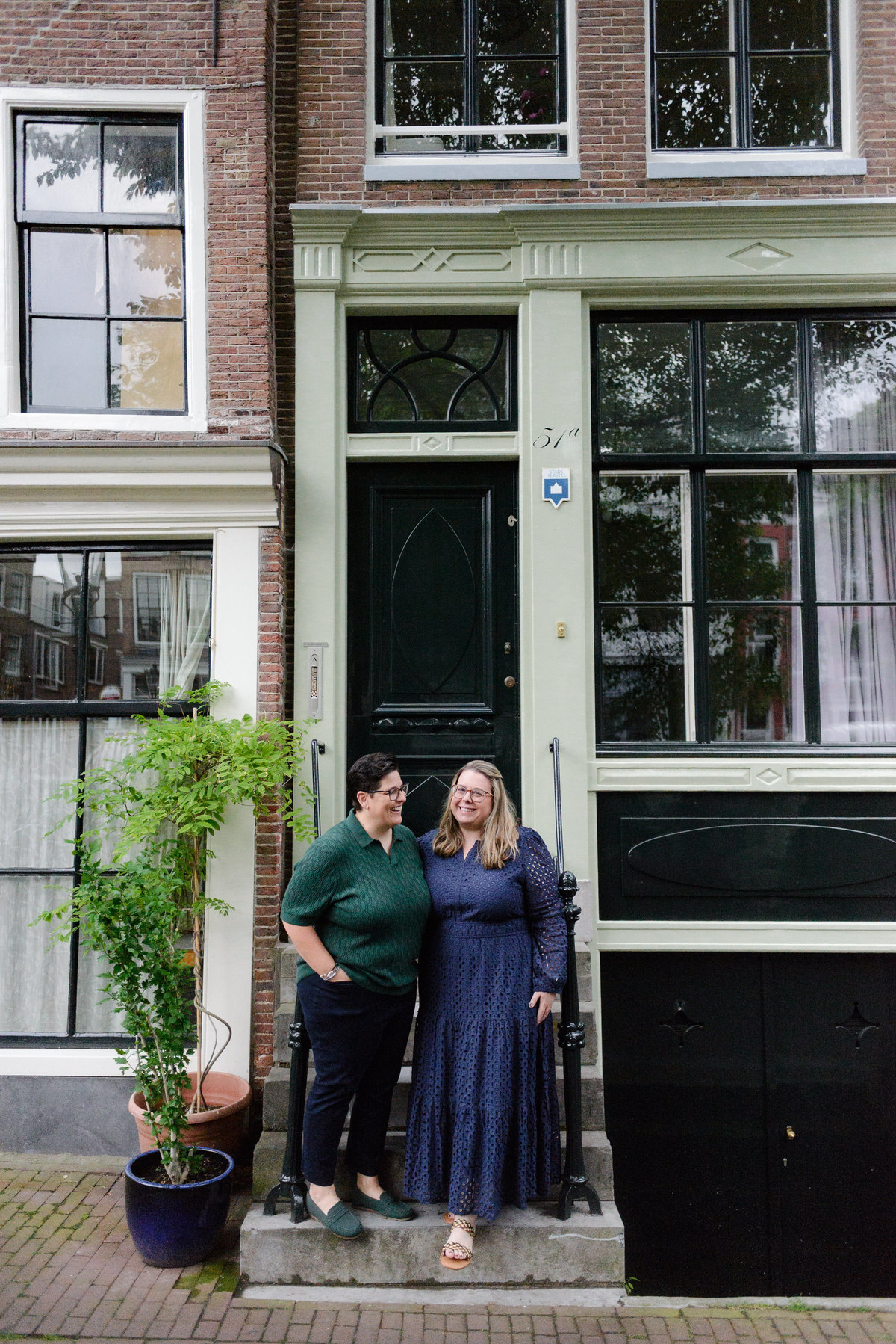 Romantic portrait of a couple in Amsterdam's historic streets.