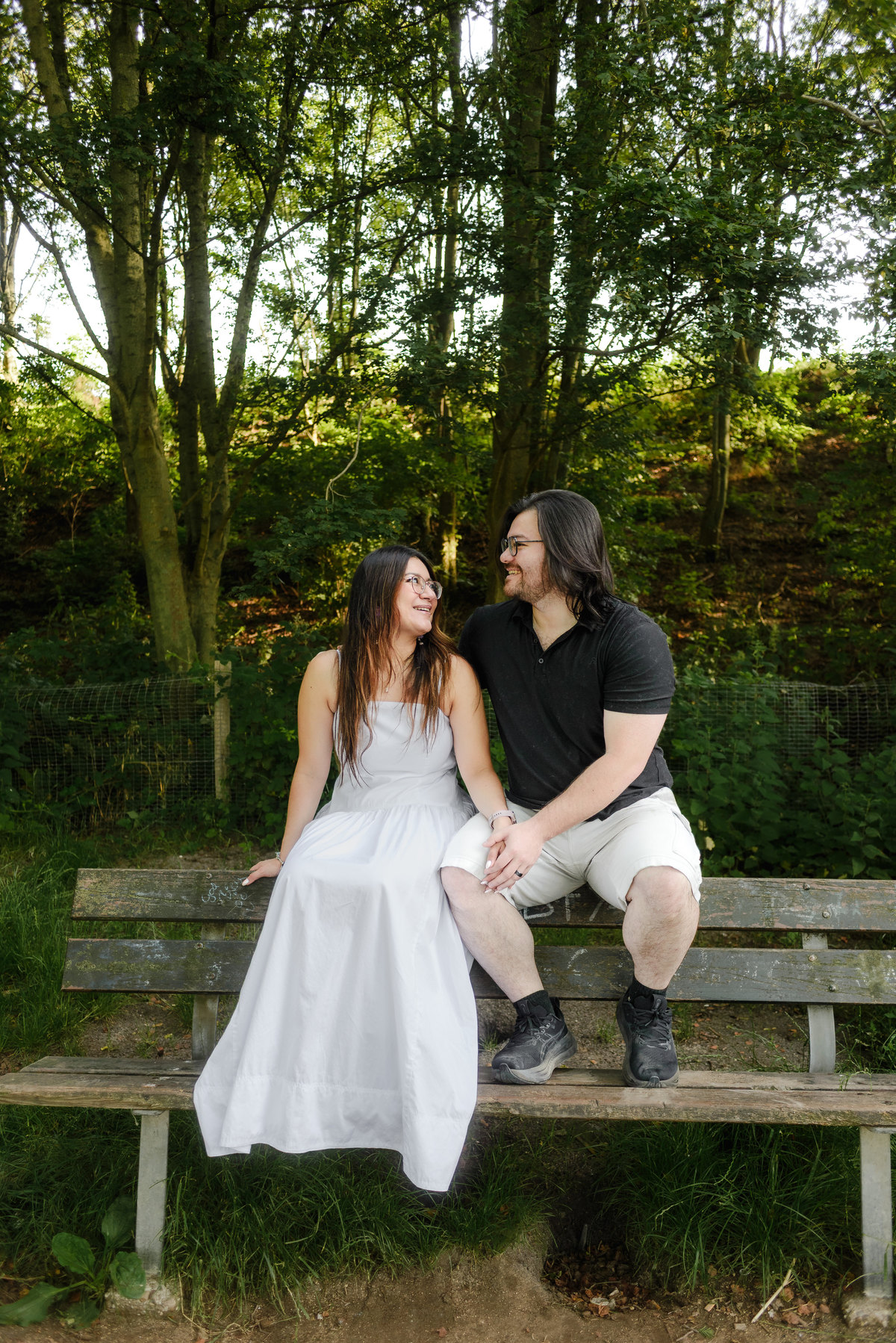 Romantic portrait of a couple surrounded by greenery in Amsterdam.