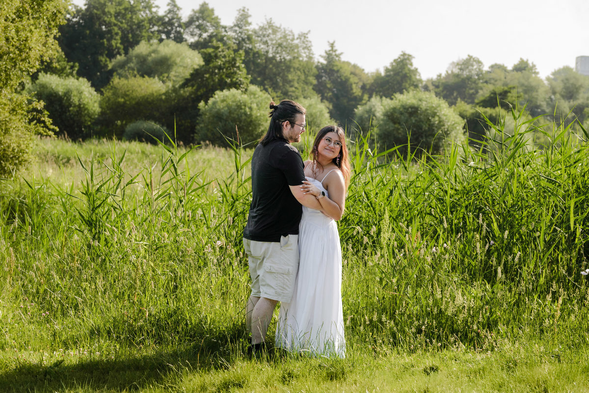 Candid engagement portrait surrounded by nature in Westerpark.