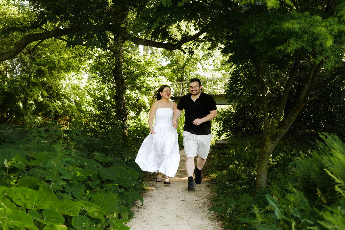Romantic portrait of a couple surrounded by greenery in Amsterdam.