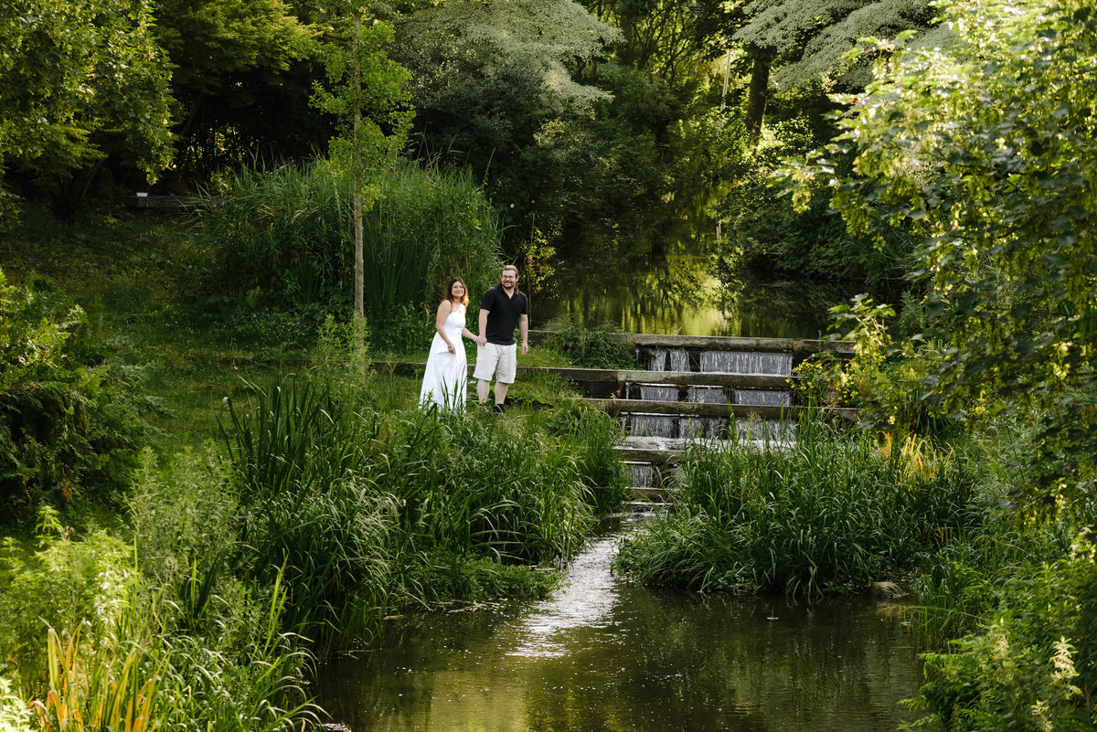 Romantic portrait of a couple surrounded by greenery in Amsterdam.
