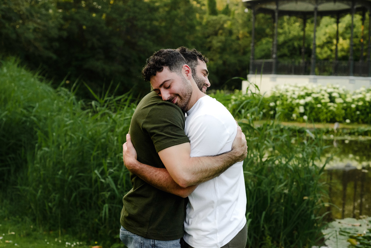 Couple embracing after saying yes during a proposal in Amsterdam.