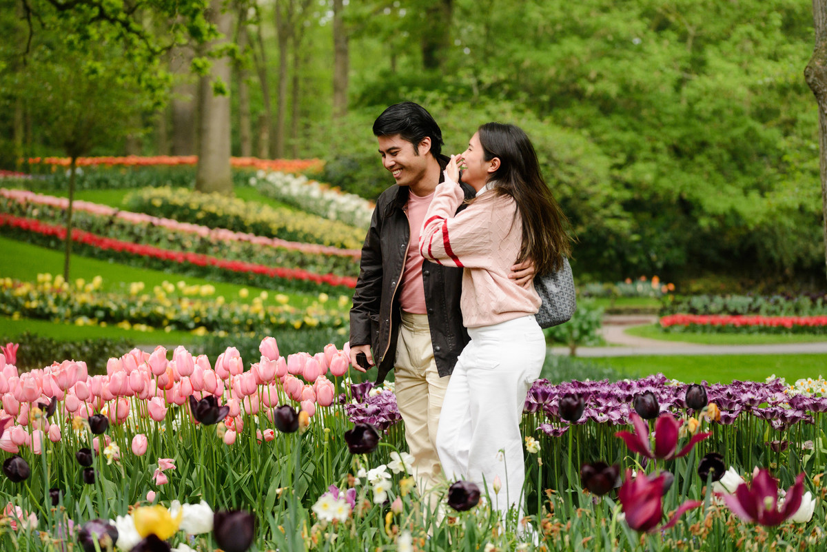 Emotional engagement proposal among colourful tulips at Keukenhof.