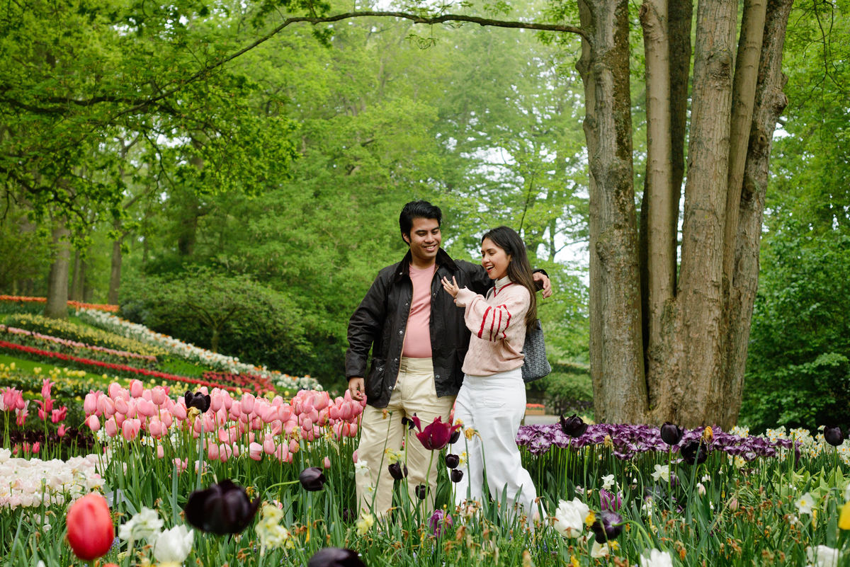 Newly engaged couple celebrating at Keukenhof Gardens.