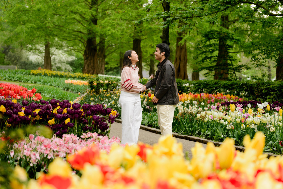 Newly engaged couple celebrating at Keukenhof Gardens.