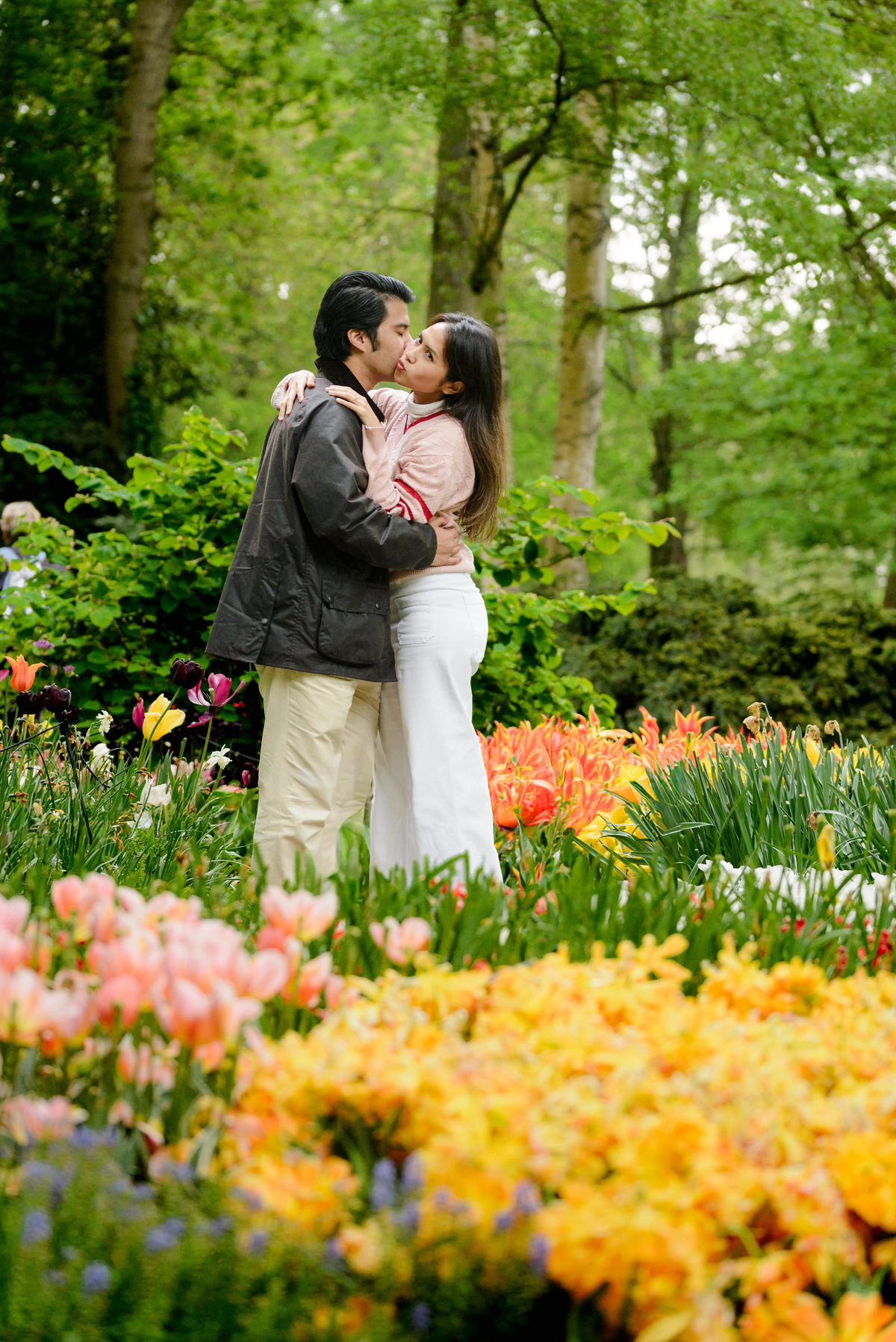 Newly engaged couple celebrating at Keukenhof Gardens.