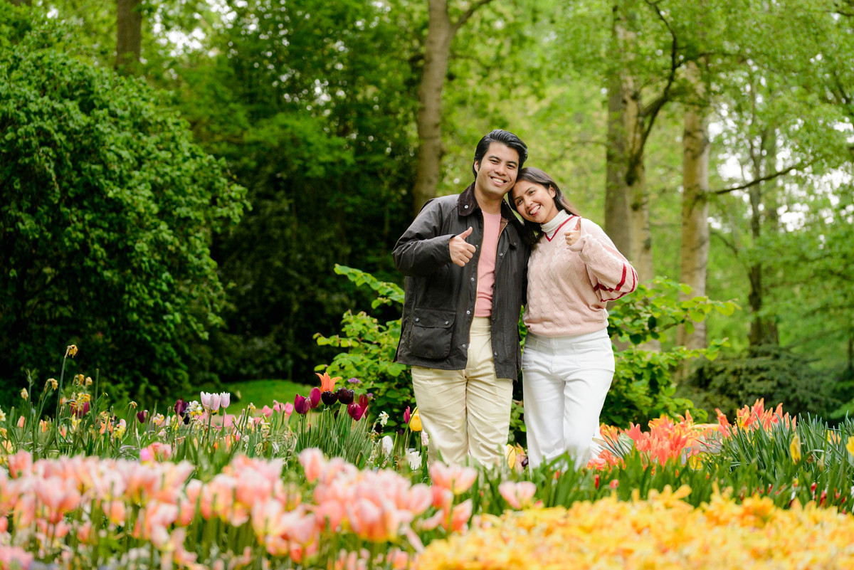 Newly engaged couple celebrating at Keukenhof Gardens.