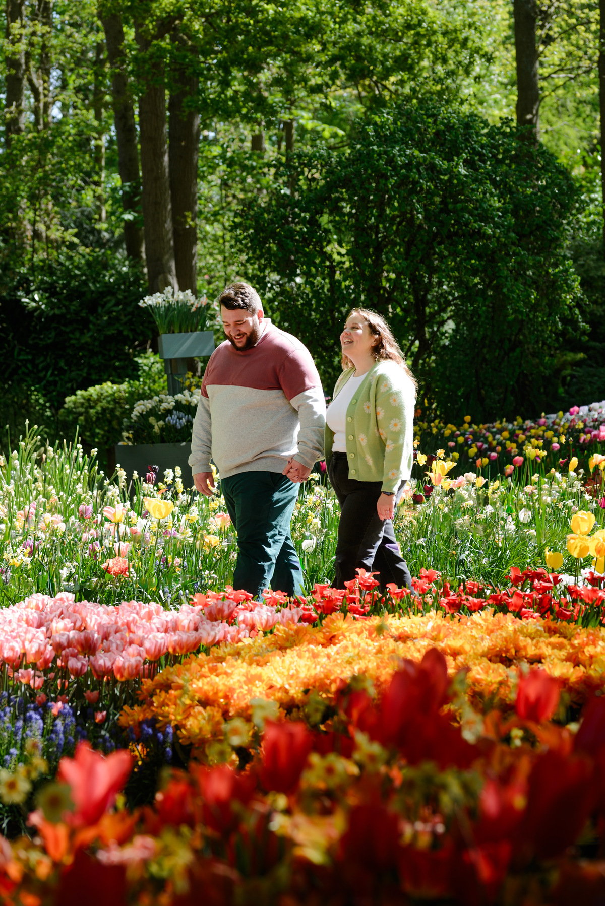 Romantic engagement portraits surrounded by tulips at Keukenhof.