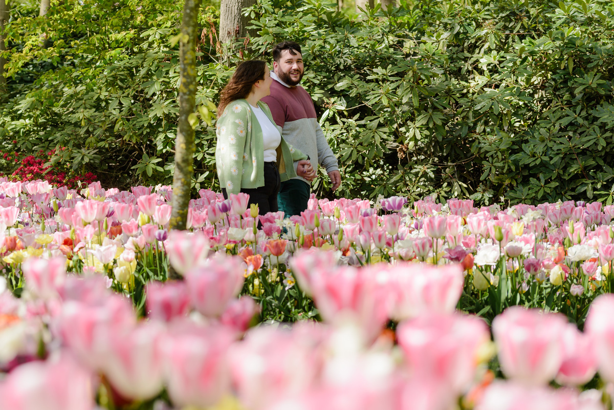 Romantic portraits with vibrant spring flowers in the background.