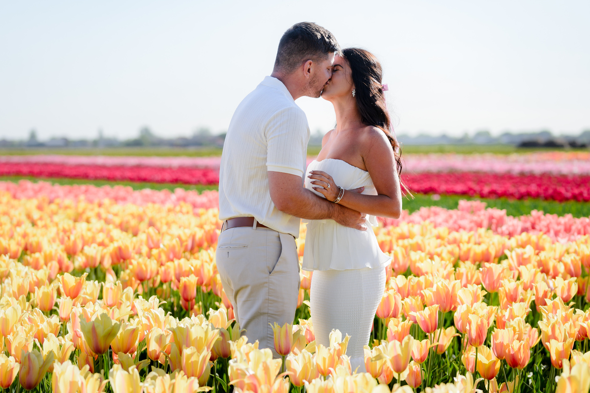 Romantic couple portrait in the tulip fields of Tulip Experience Amsterdam.