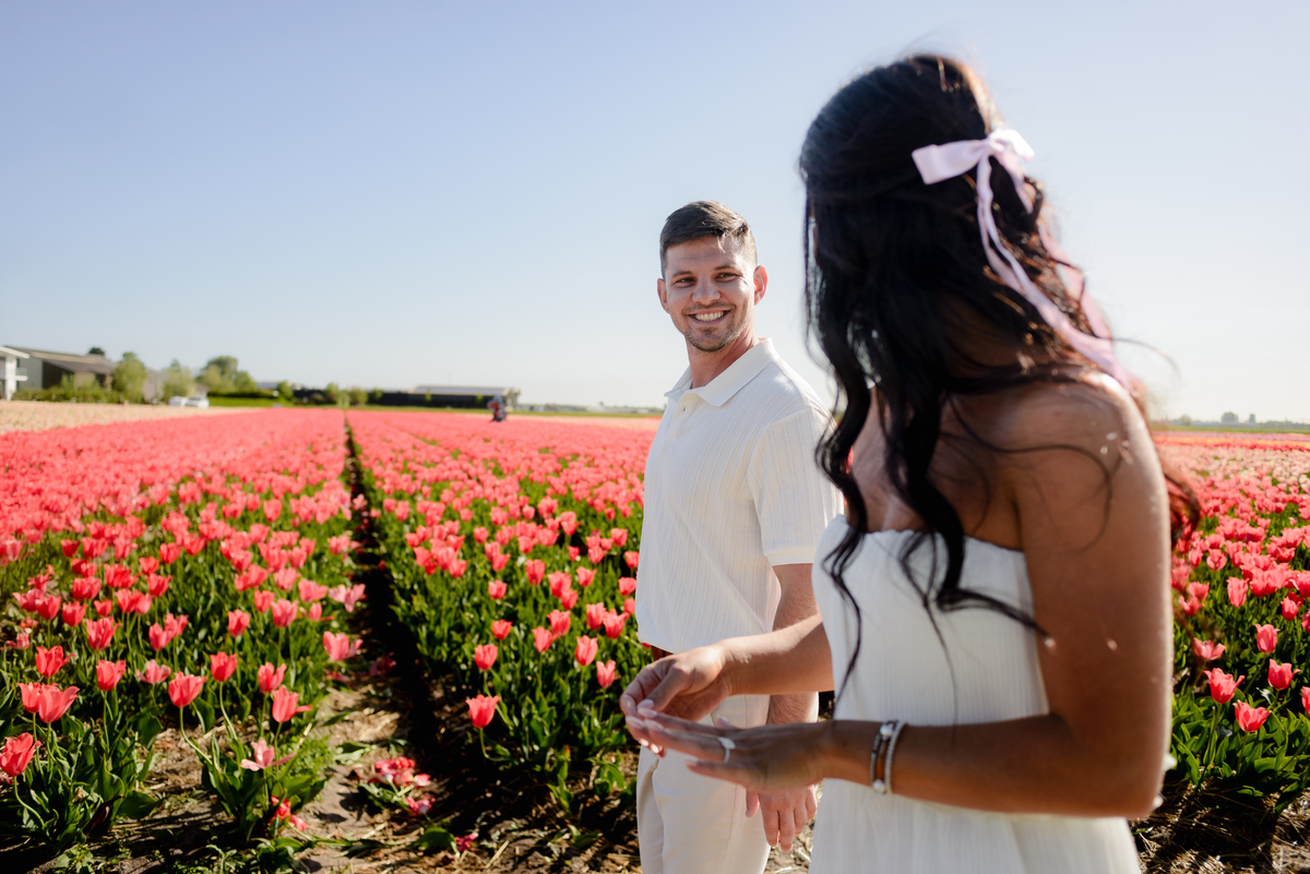 Romantic couple portrait in the tulip fields of Tulip Experience Amsterdam.