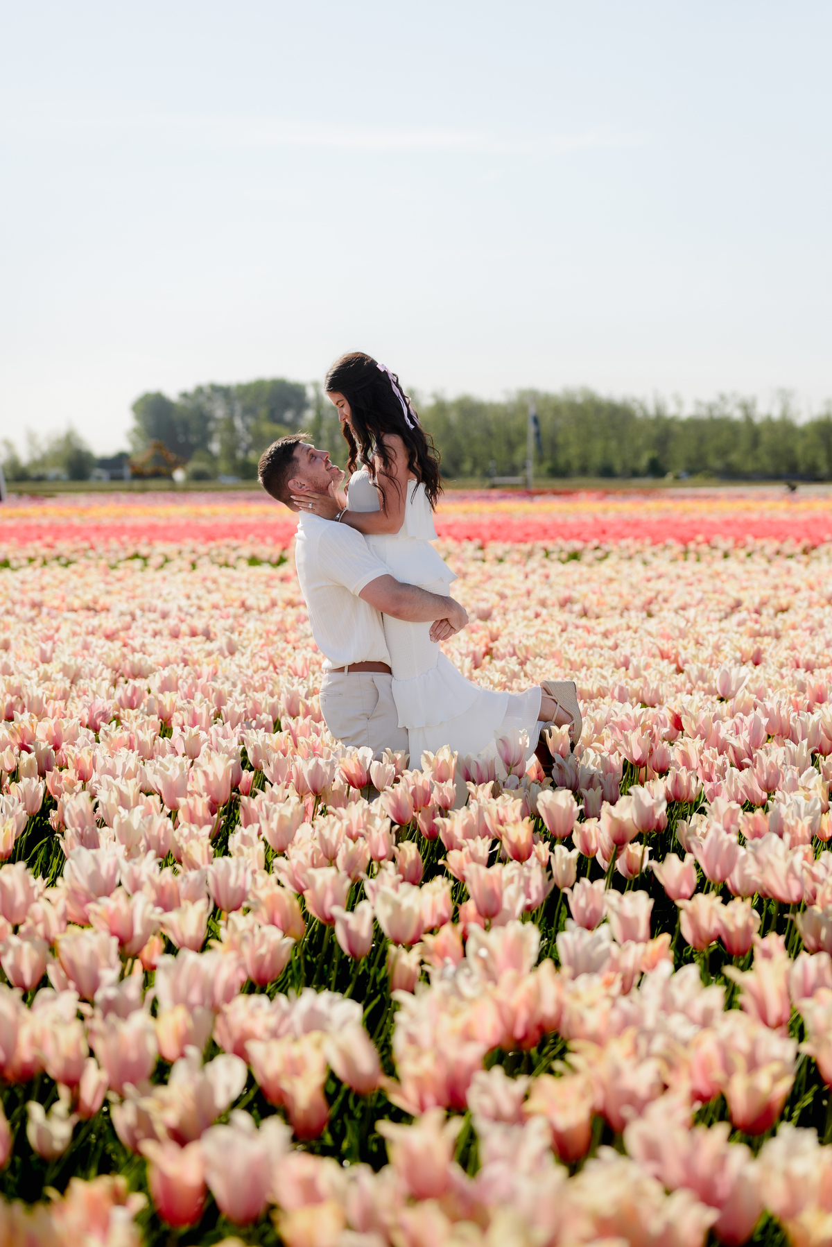 Romantic couple portrait in the tulip fields of Tulip Experience Amsterdam.