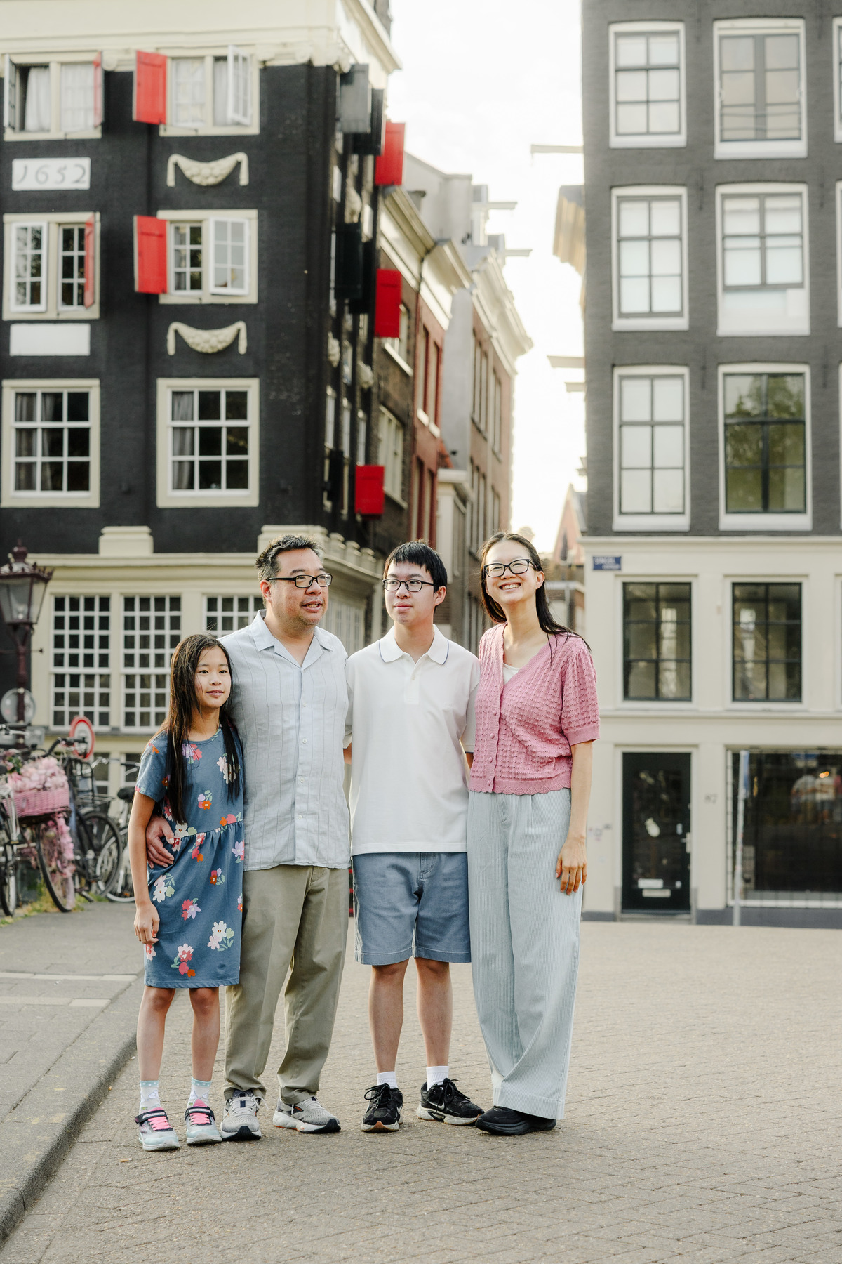 Children laughing while exploring Amsterdam with their parents.