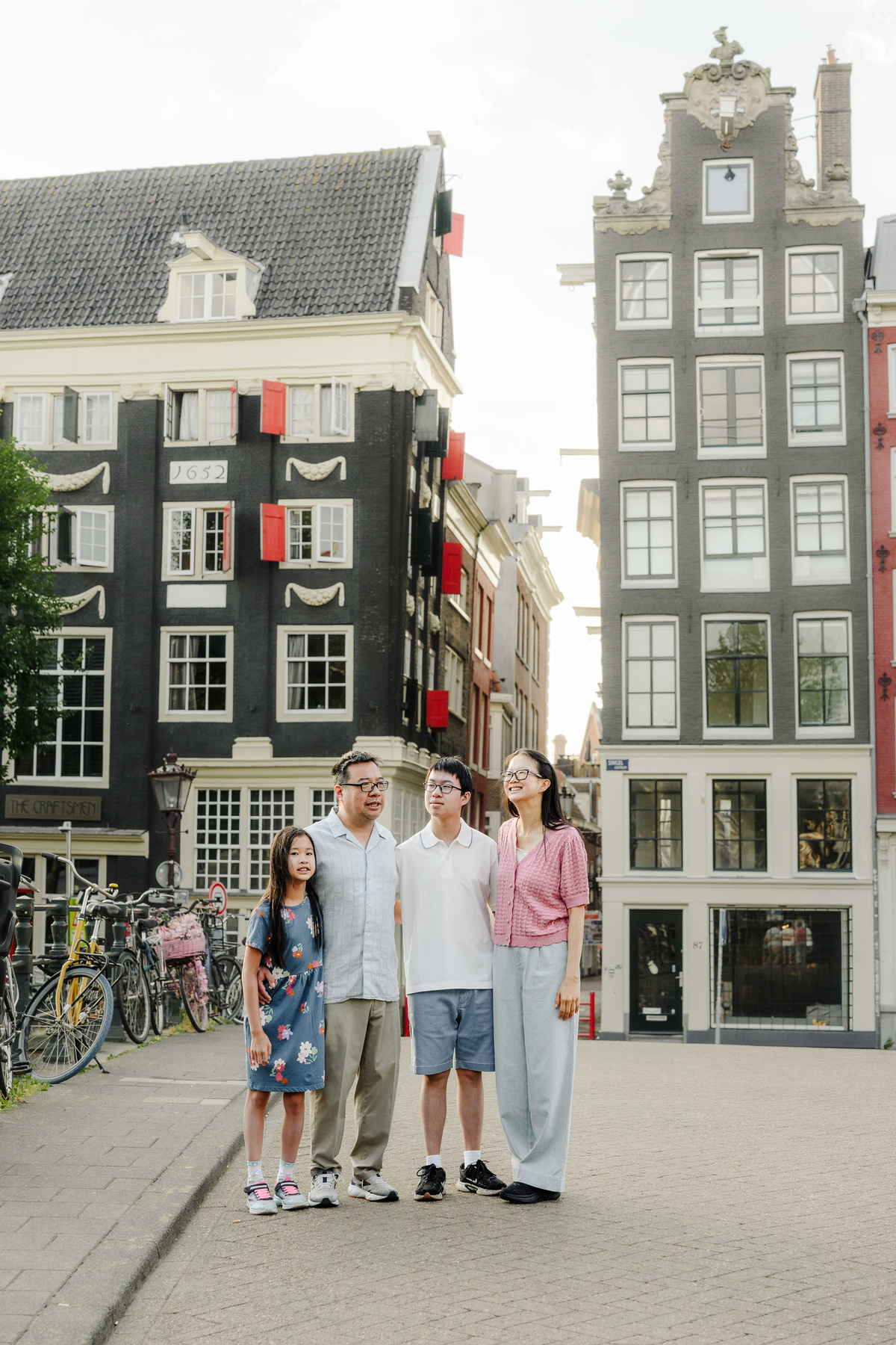 Parents embracing their children during a vacation photo session.