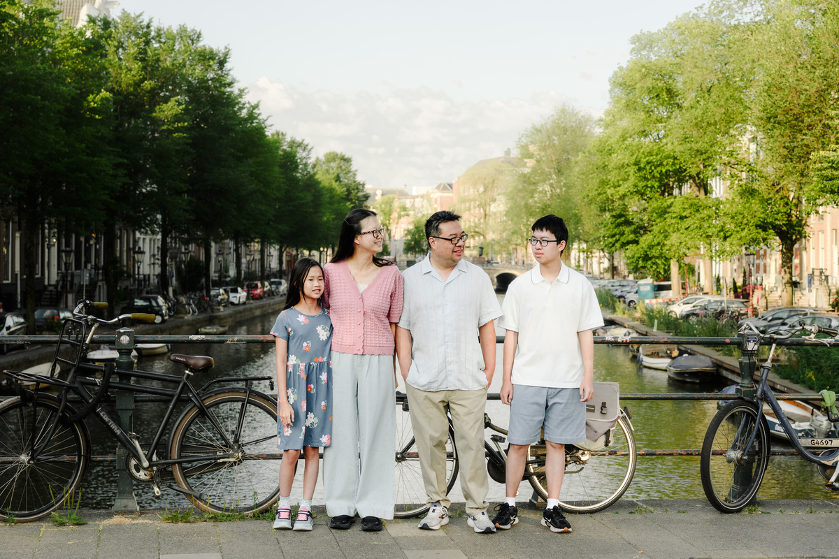 Parents embracing their children during a vacation photo session.