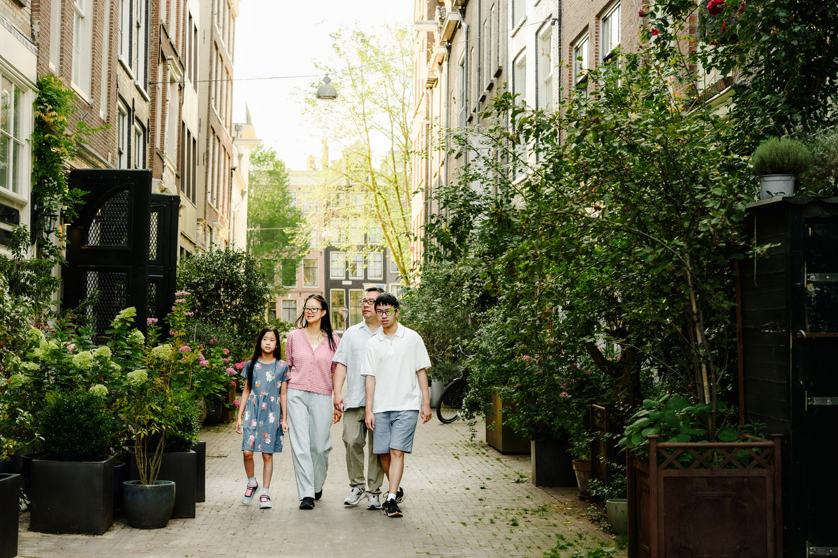 Candid family photograph in Amsterdam's historic city centre.