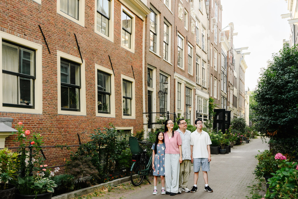Family exploring Amsterdam's canals together.