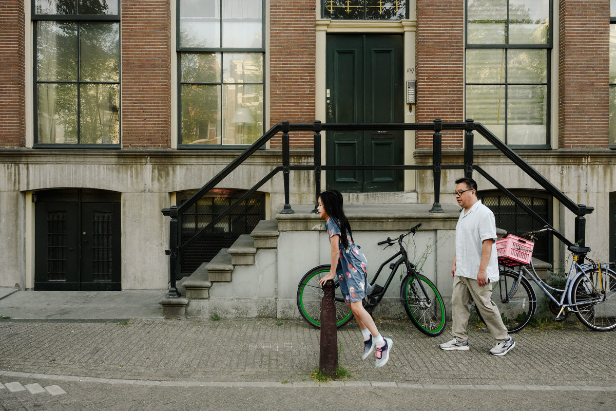 Candid family photograph in Amsterdam's historic city centre.