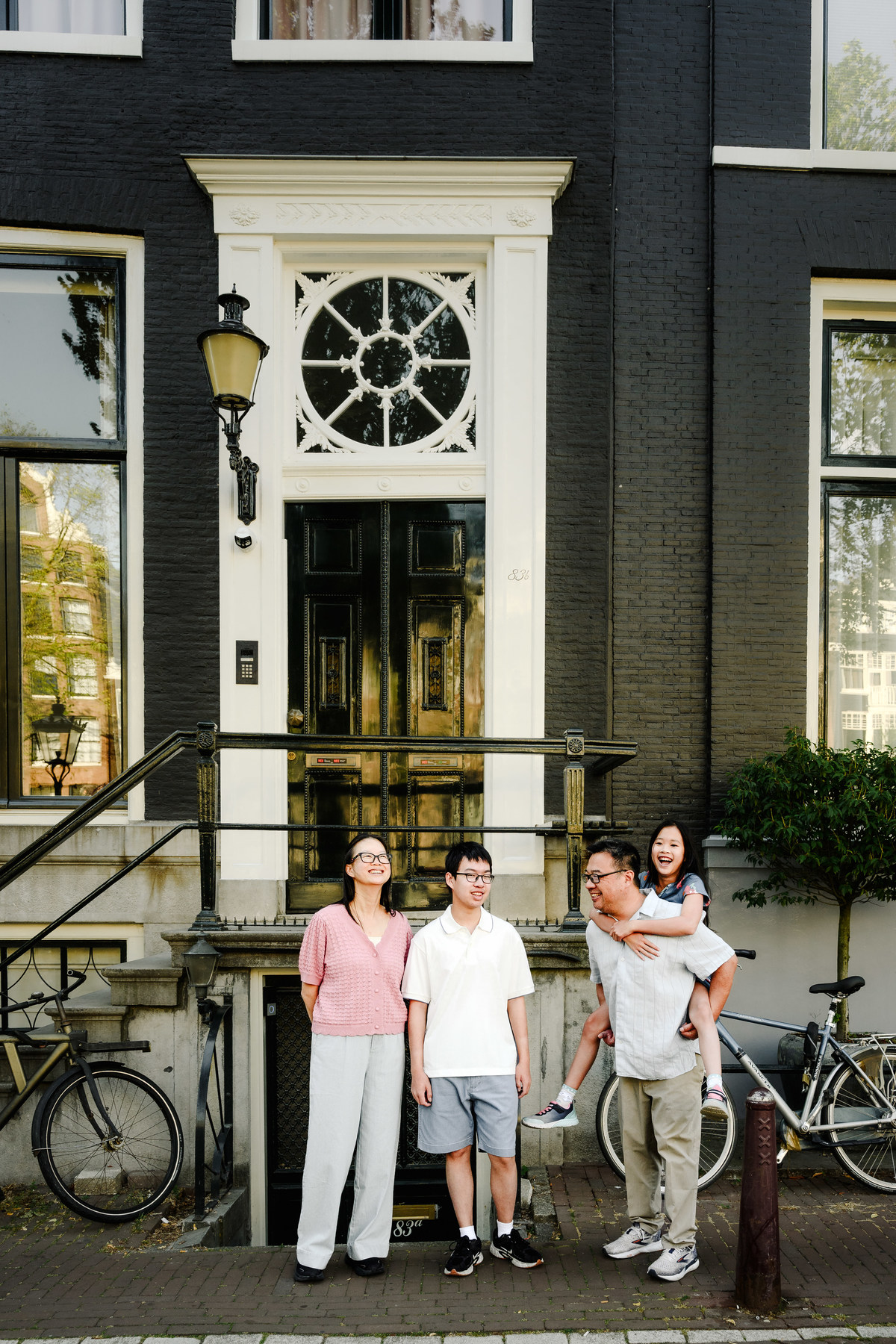 Candid family photograph in Amsterdam's historic city centre.