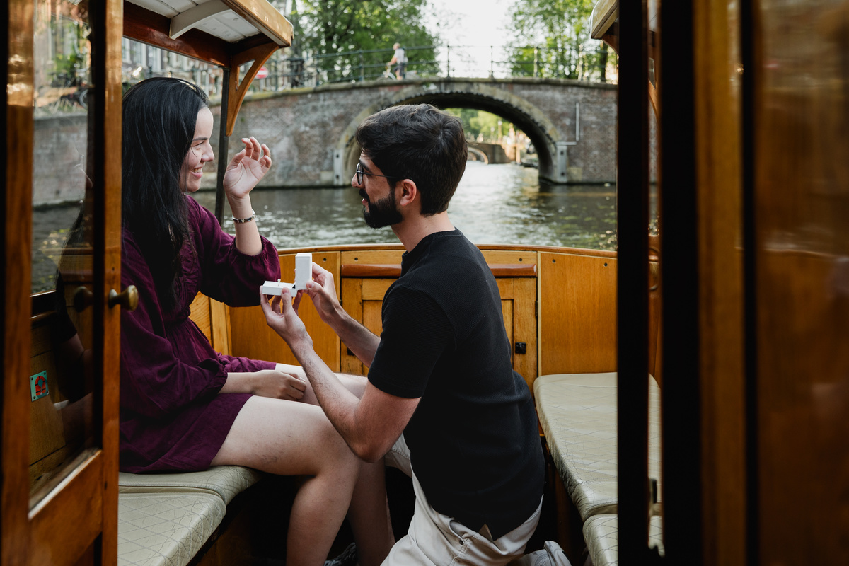 Surprise proposal on a private Amsterdam canal boat.