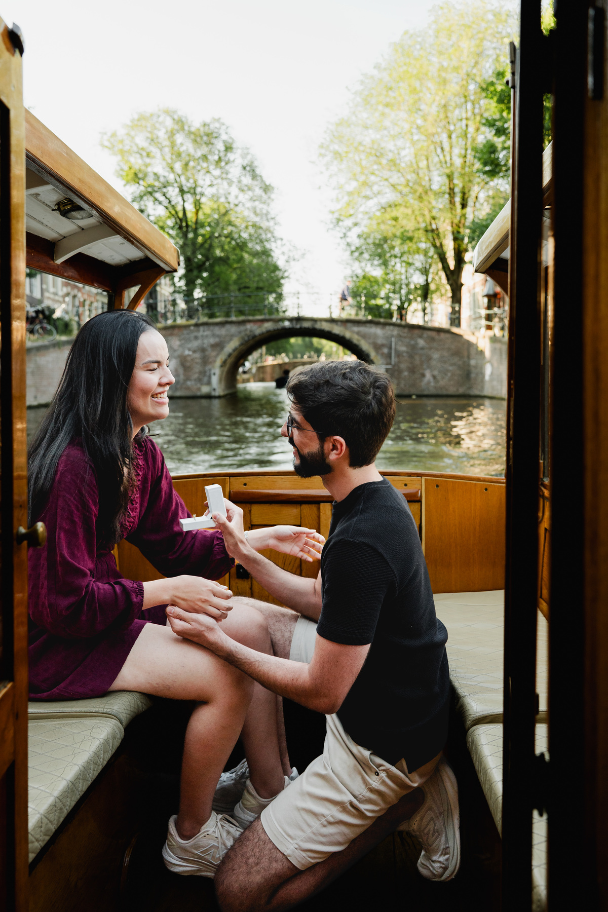 Marriage proposal captured aboard a historic Amsterdam canal boat.
