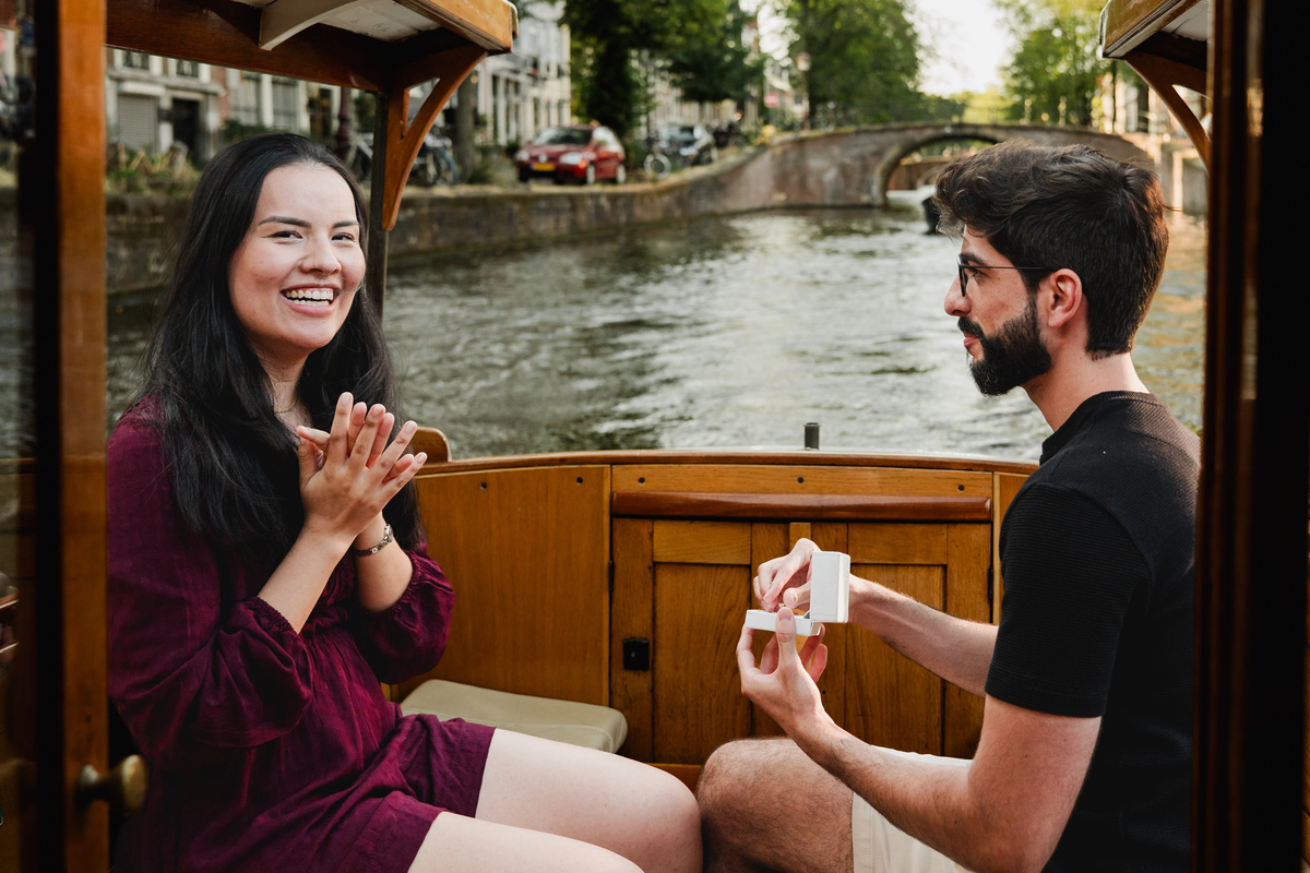 Marriage proposal captured aboard a historic Amsterdam canal boat.