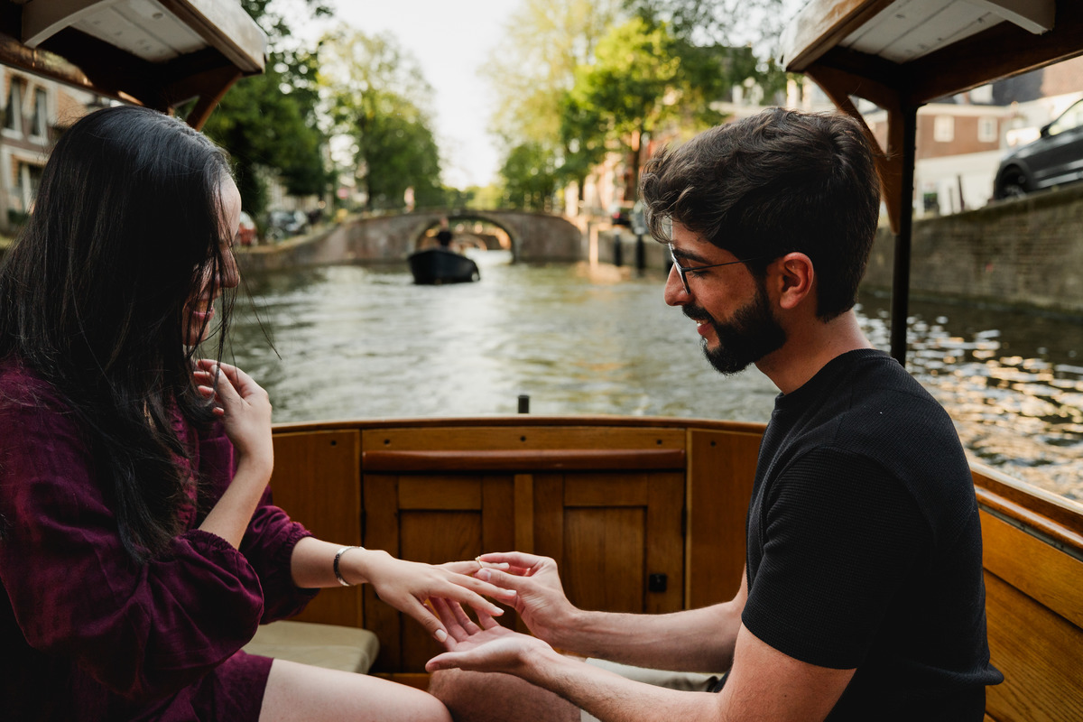 Marriage proposal captured aboard a historic Amsterdam canal boat.