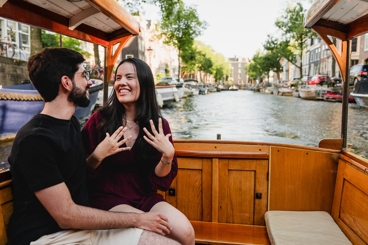 Couple celebrating their engagement on Amsterdam's canals.