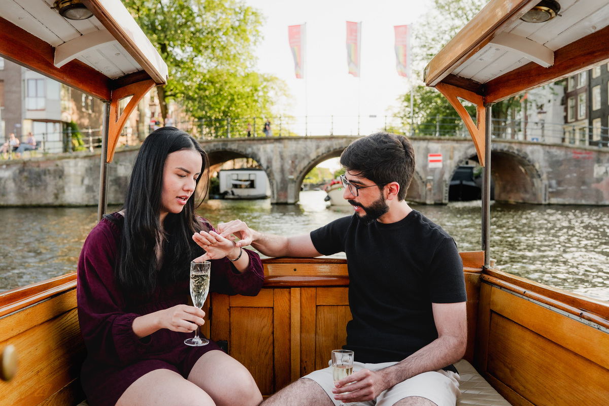 Marriage proposal captured aboard a historic Amsterdam canal boat.