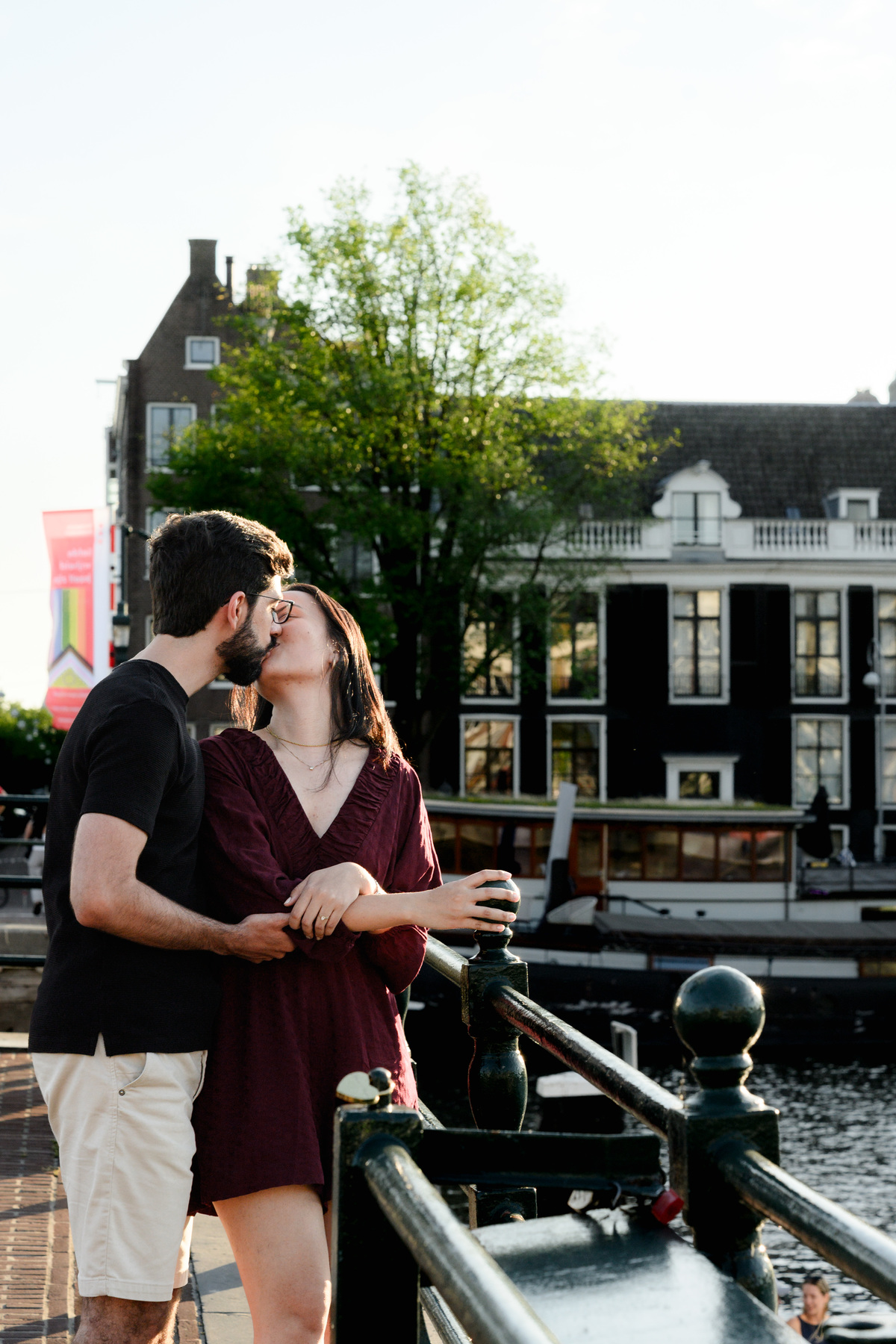 Romantic engagement portrait beside Amsterdam river after the proposal.