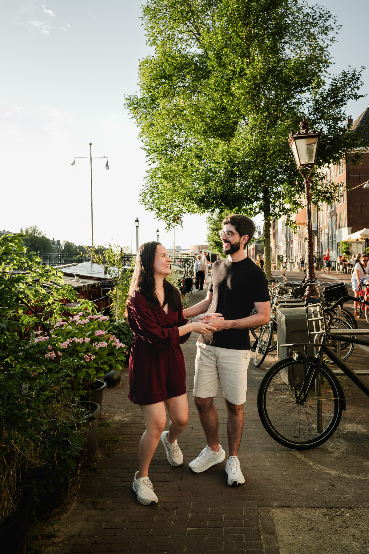 Romantic portrait of an engaged couplet the Skinny Bridge after their engagement proposal on a boat
