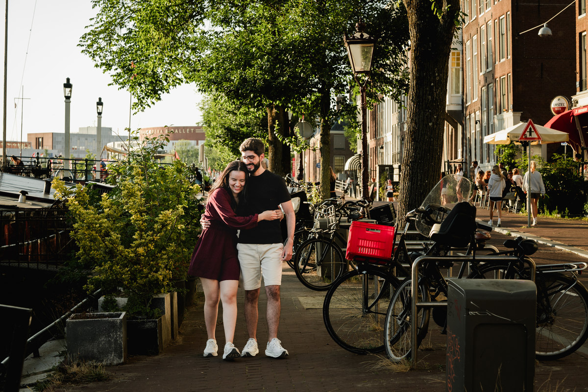 Romantic portrait of an engaged couplet the Skinny Bridge after their engagement proposal on a boat