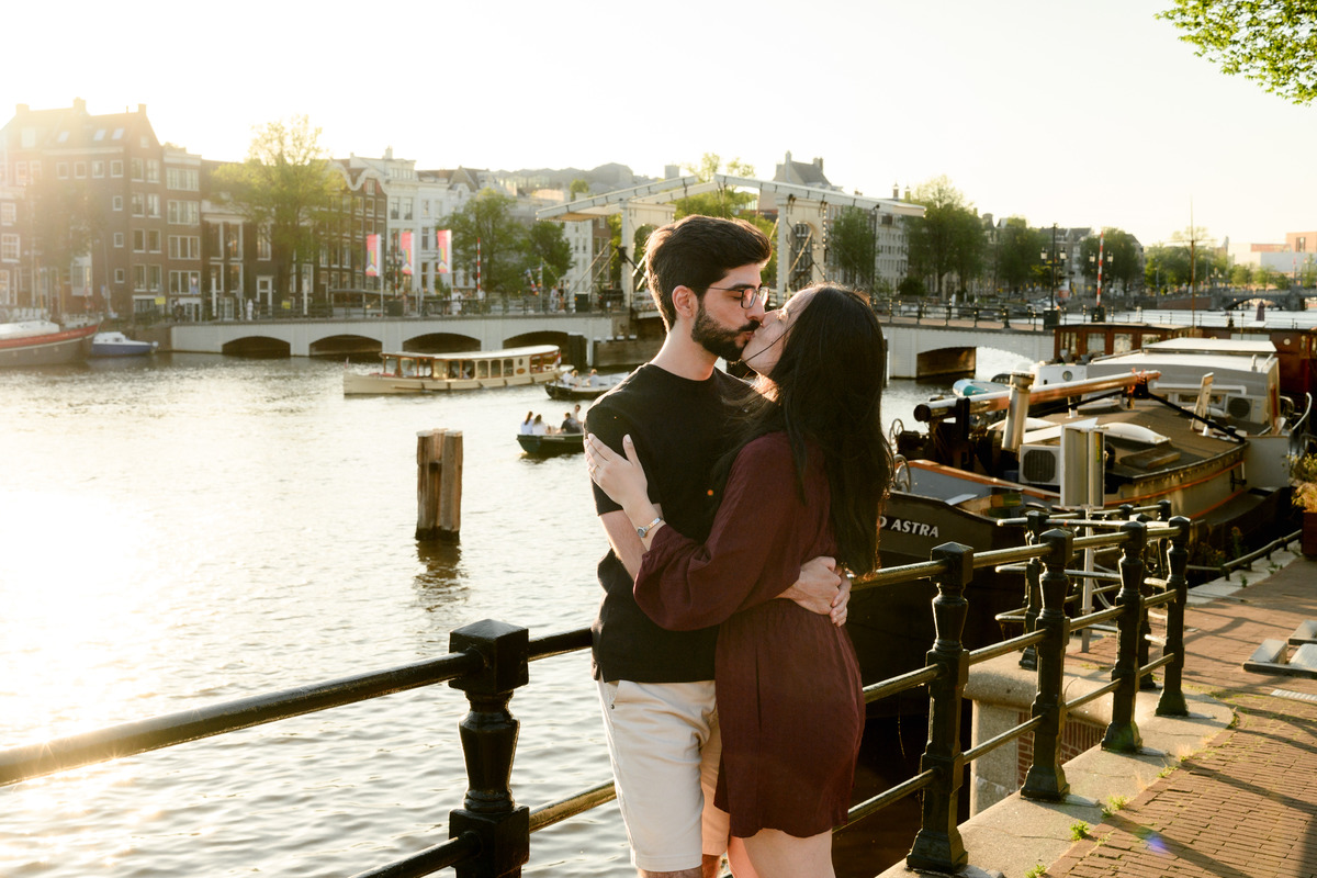 Romantic portrait of an engaged couplet the Skinny Bridge after their engagement proposal on a boat