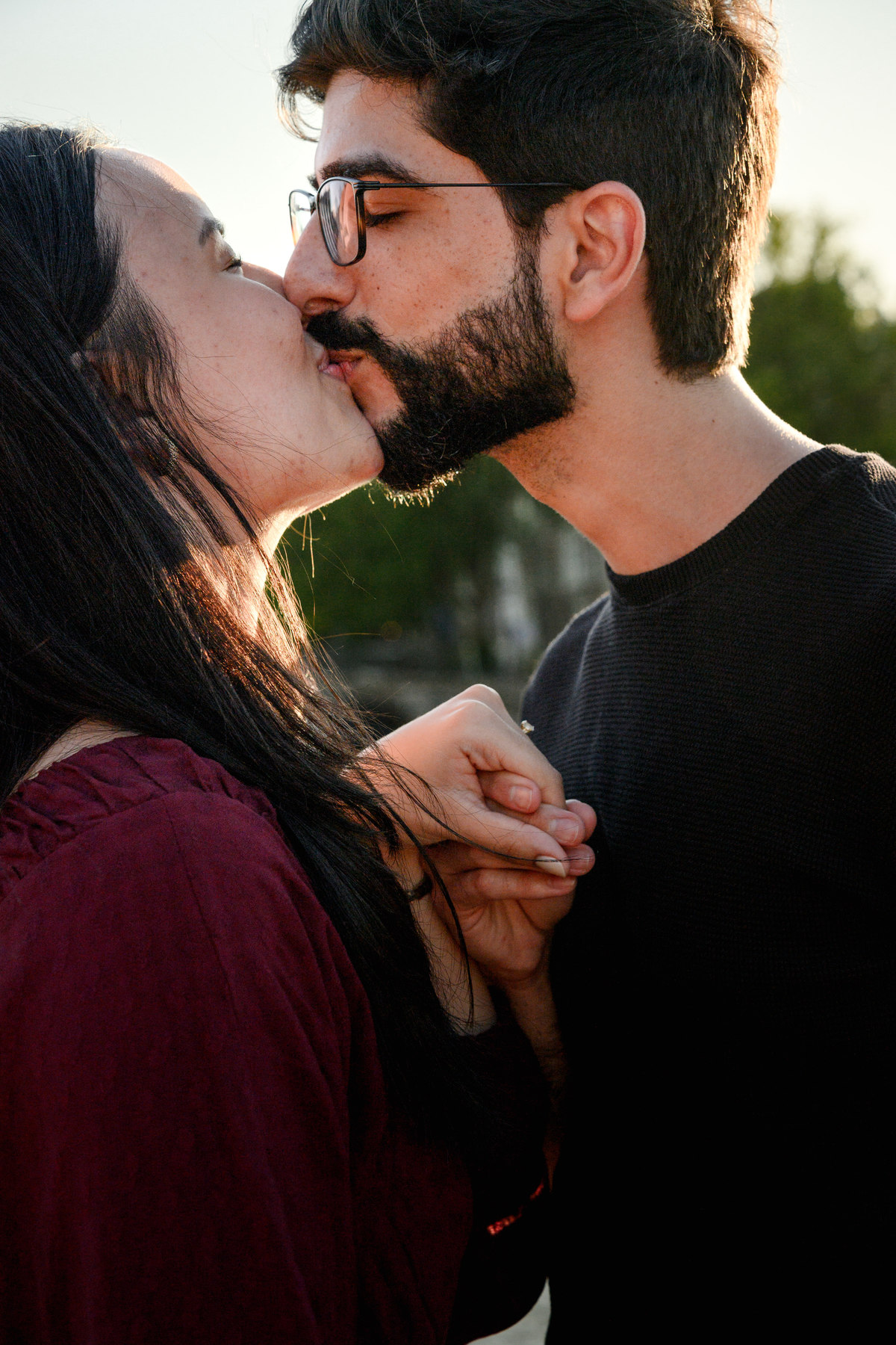 Romantic portrait of an engaged couplet the Skinny Bridge after their engagement proposal on a boat