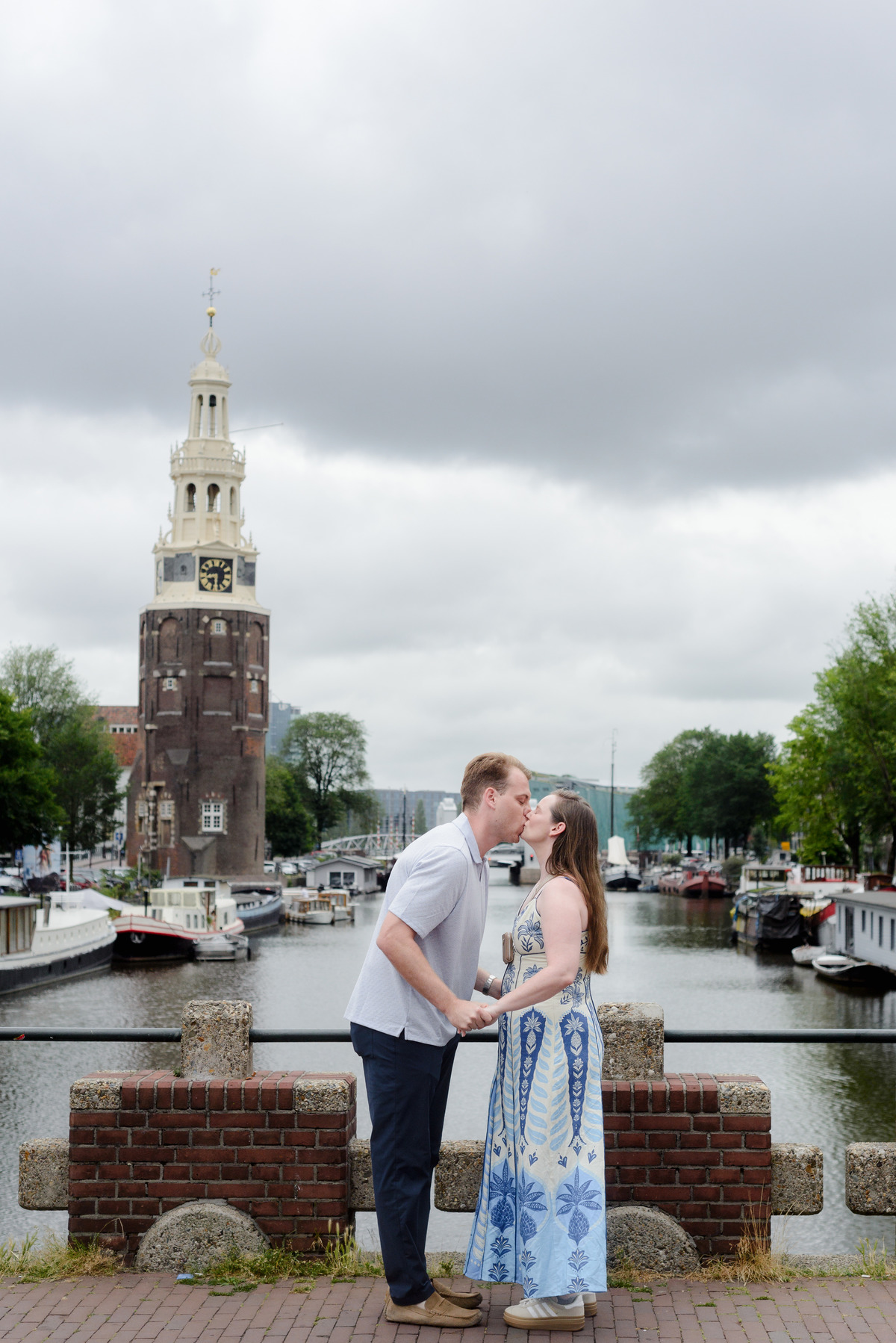 Newly engaged couple embracing after their Keizerbrug proposal