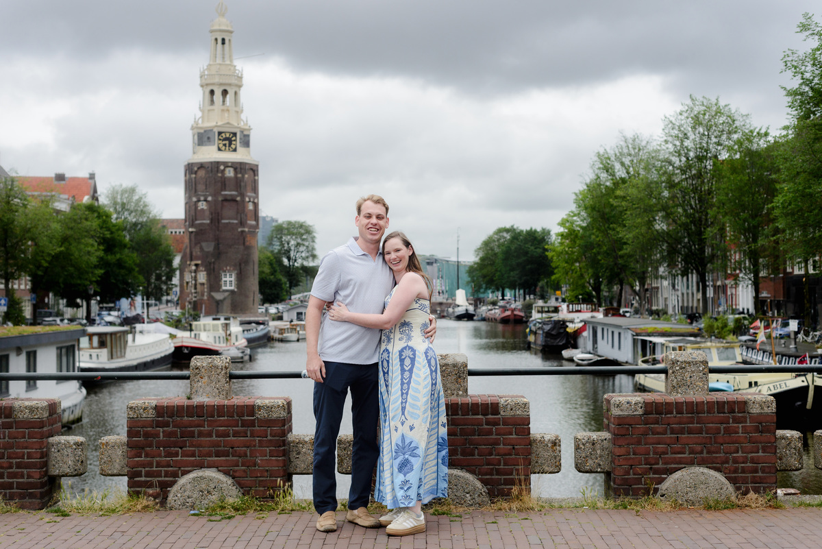Newly engaged couple embracing after their Keizerbrug proposal