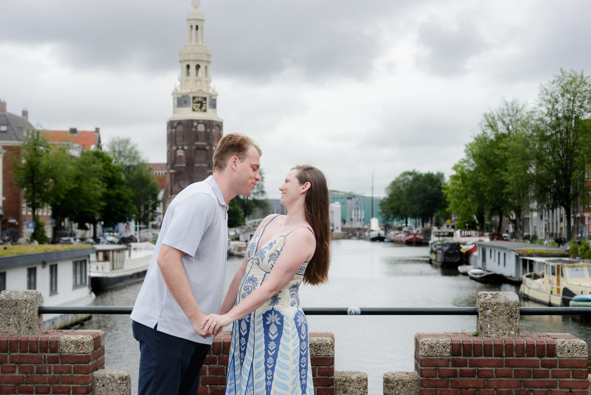 Newly engaged couple embracing after their Keizerbrug proposal