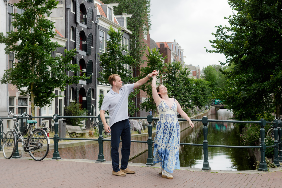 Couple celebrating their engagement beside the canals in Amsterdam