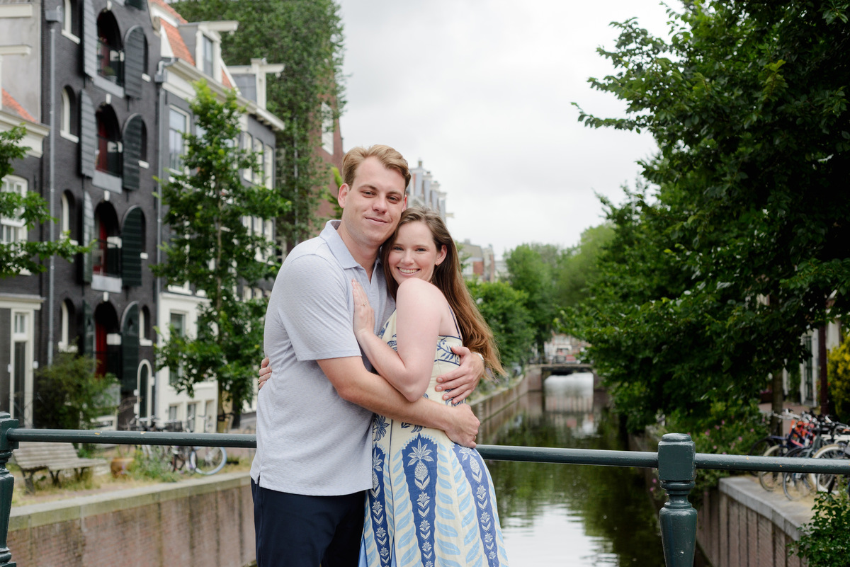 Couple celebrating their engagement beside the canals in Amsterdam
