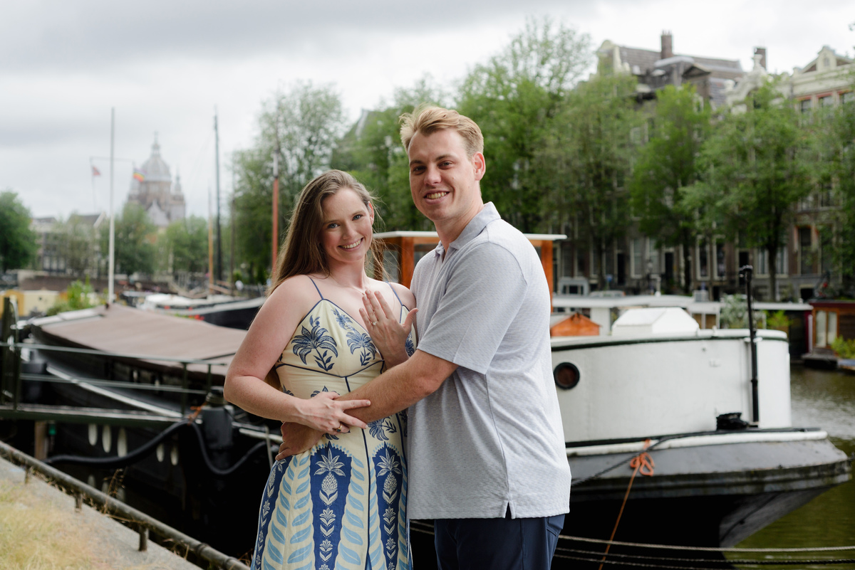 Couple celebrating their engagement beside the canals in Amsterdam