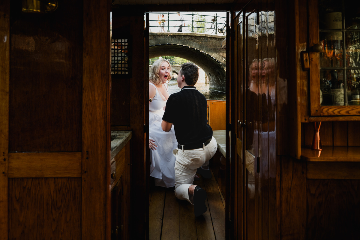 Woman reacting to a surprise canal boat proposal
