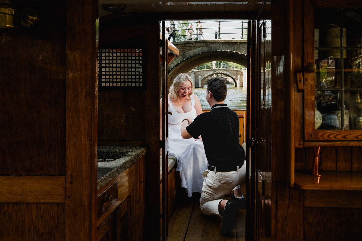 Surprise proposal beneath the Seven Bridges in Amsterdam