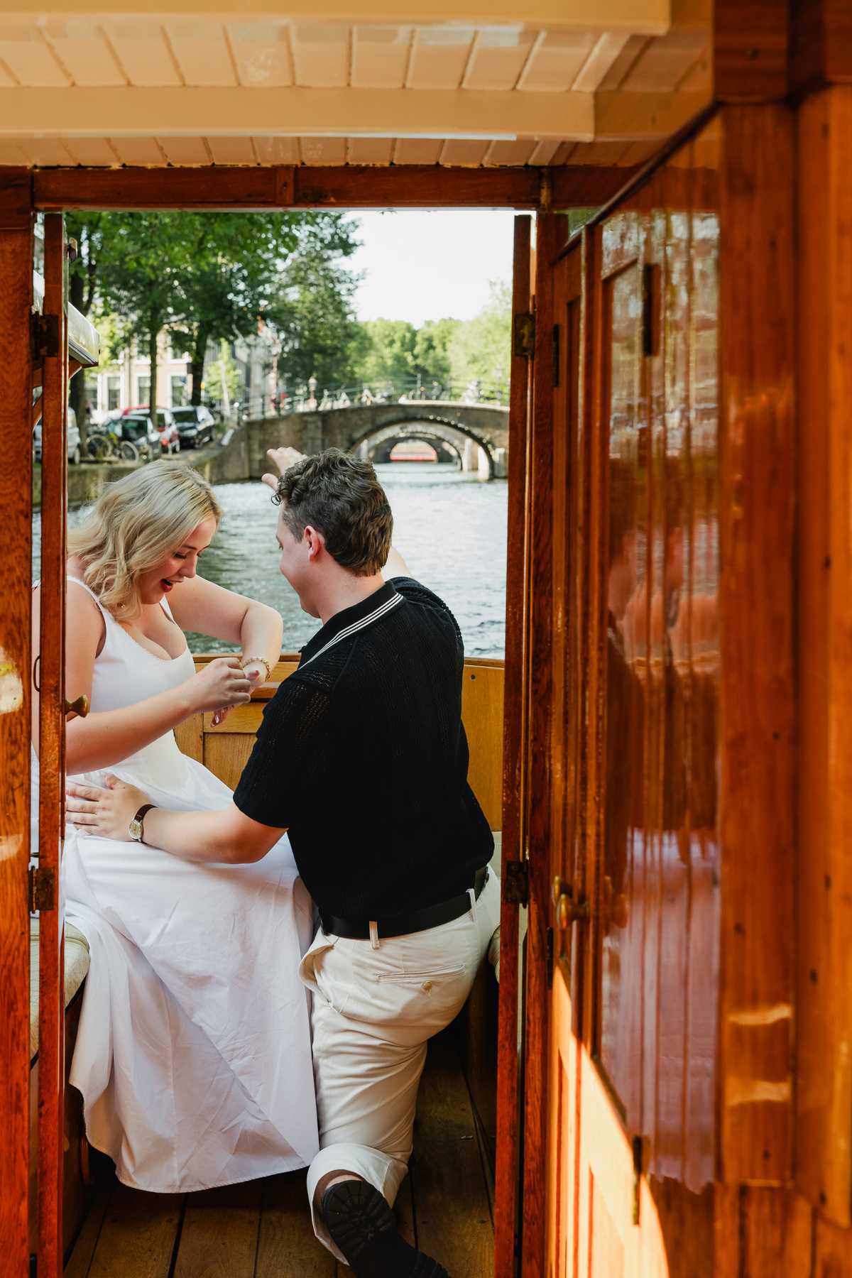 Man proposing on a private canal boat in Amsterdam