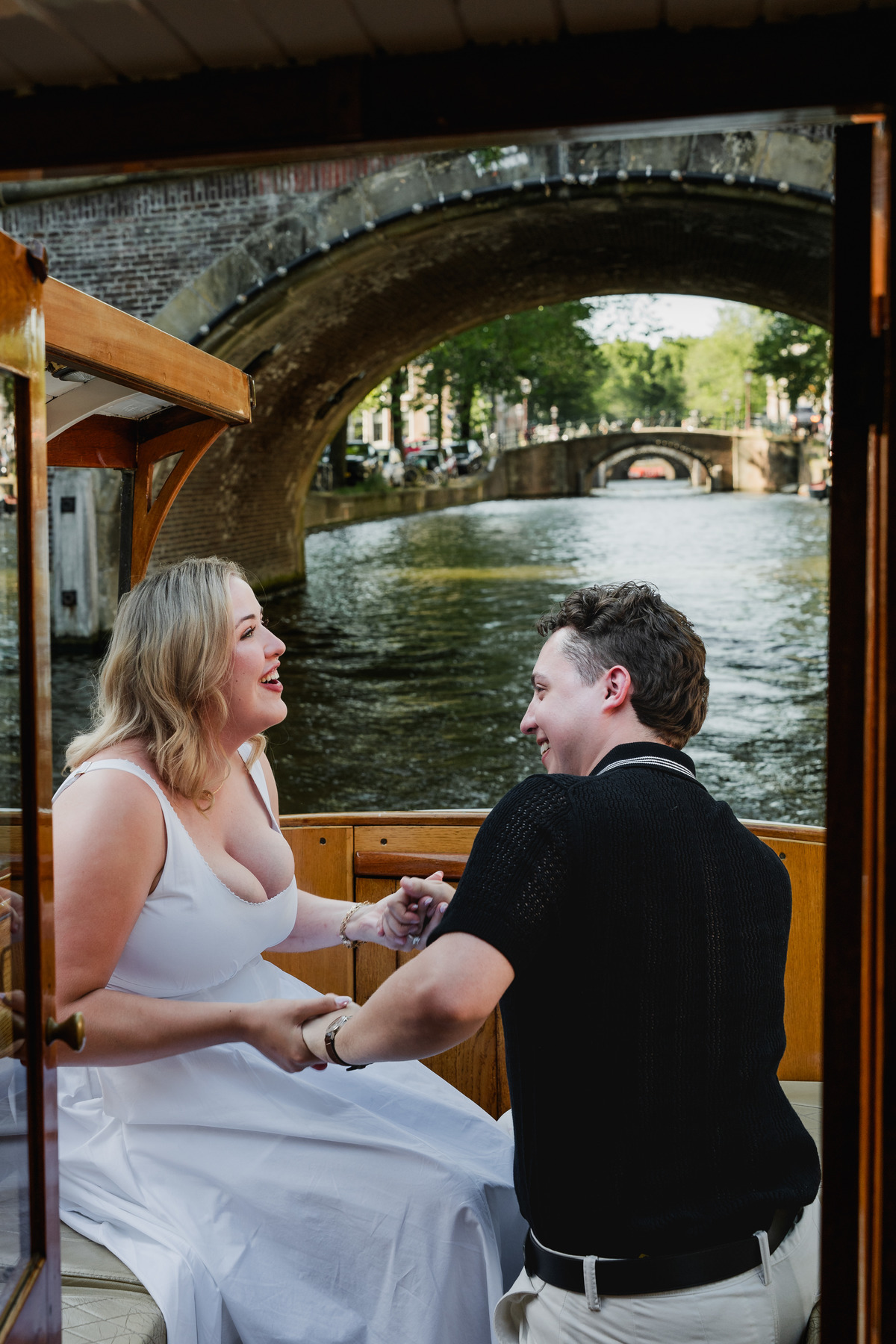 Man proposing on a private canal boat in Amsterdam
