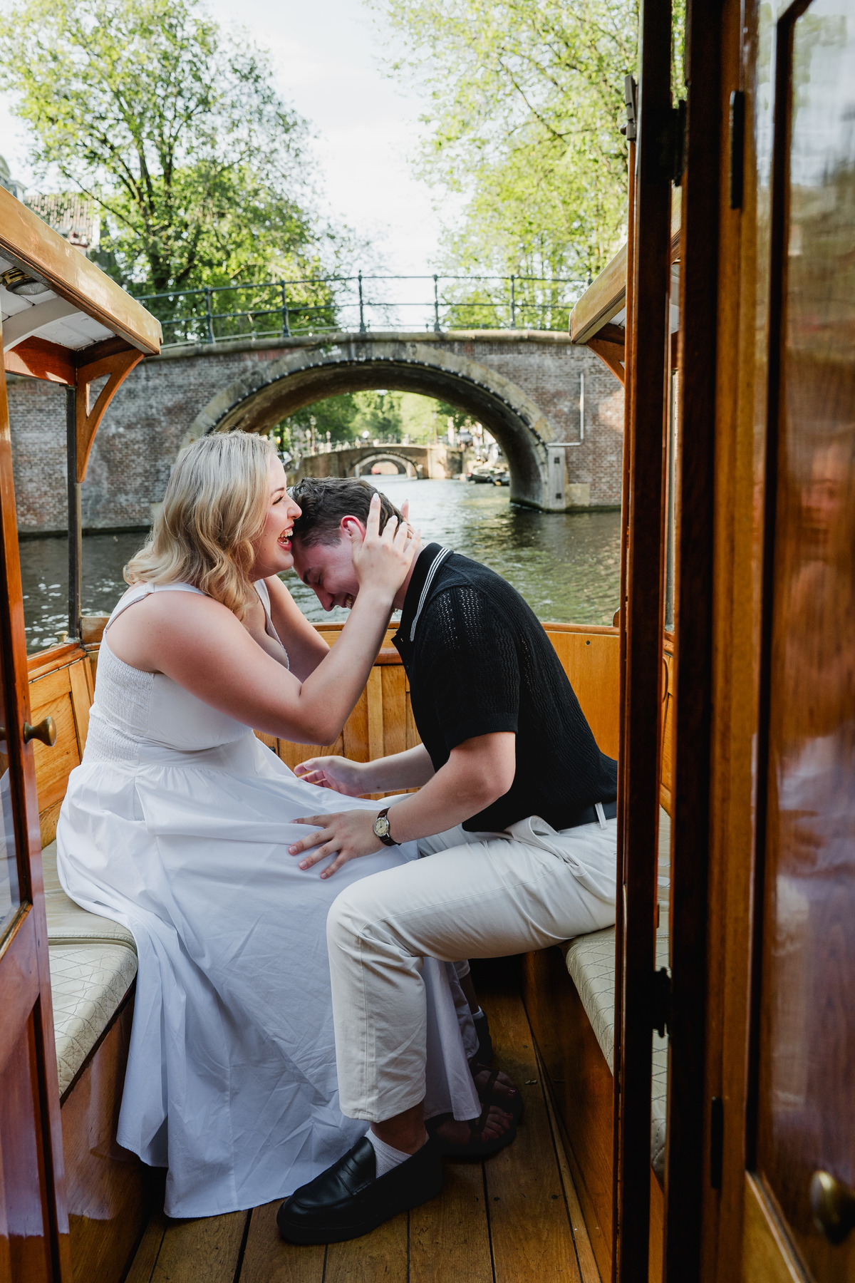 Man proposing on a private canal boat in Amsterdam