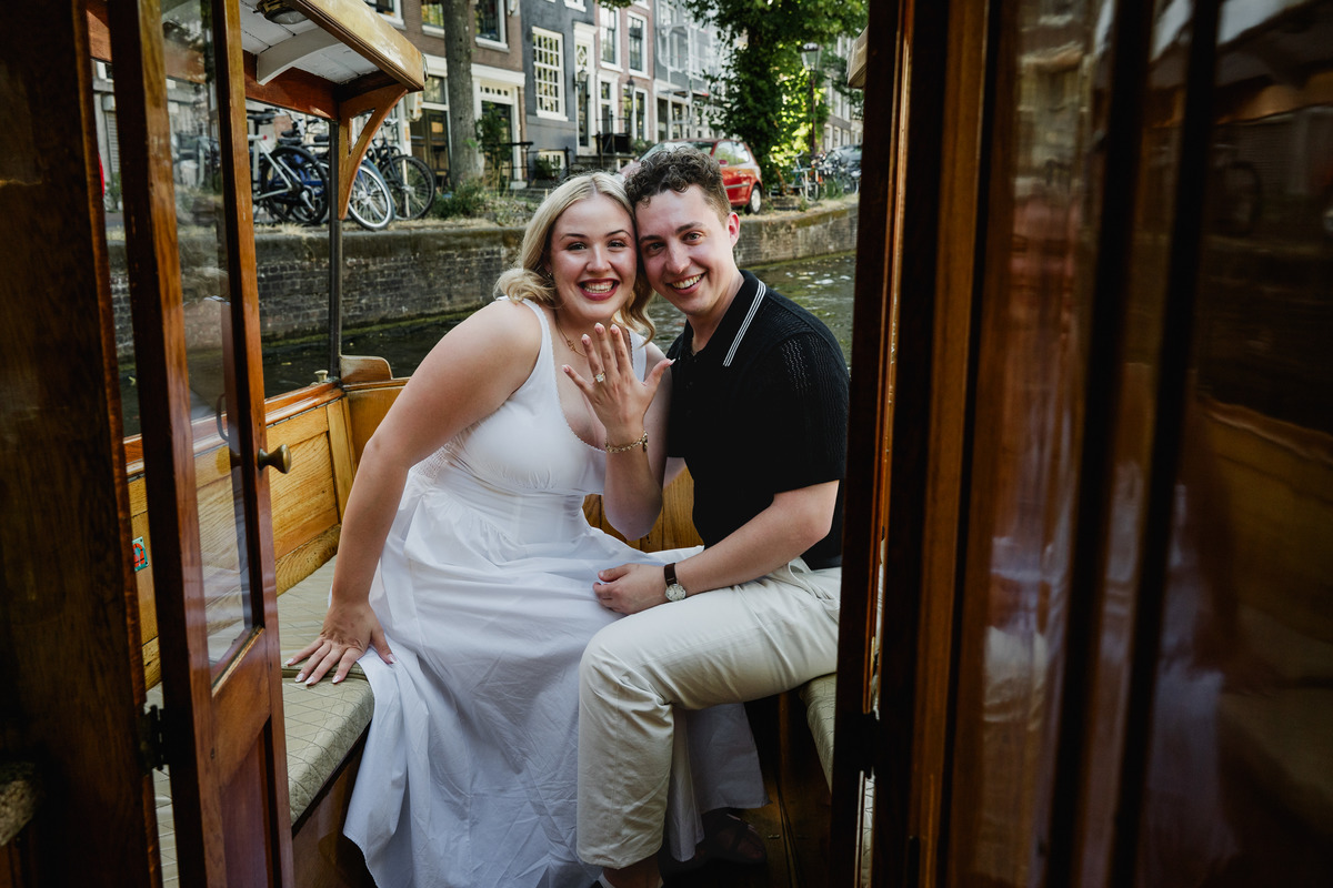Engagement ring moment aboard a historic Amsterdam canal boat