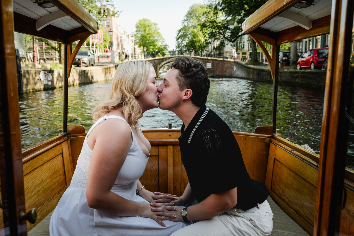 Engagement ring moment aboard a historic Amsterdam canal boat
